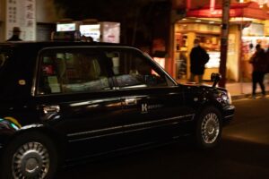 Gloss black taxi in Chinatown