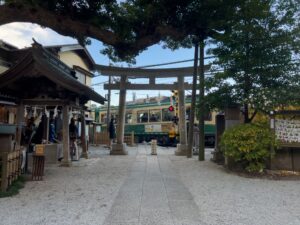 The train crossing right in front of Goryo Shrine