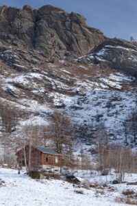 Winter cabin with a mountain background Winter cabin with a mountain background