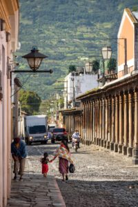 Mother and daughter walk the city streets in the early morning